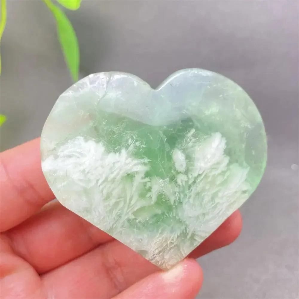 Feather Fluorite Crystal Heart: Polished green and white fluorite heart for mental clarity and emotional balance.