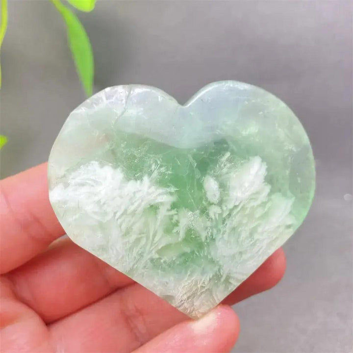 Feather Fluorite Crystal Heart: Polished green and white fluorite heart for mental clarity and emotional balance.