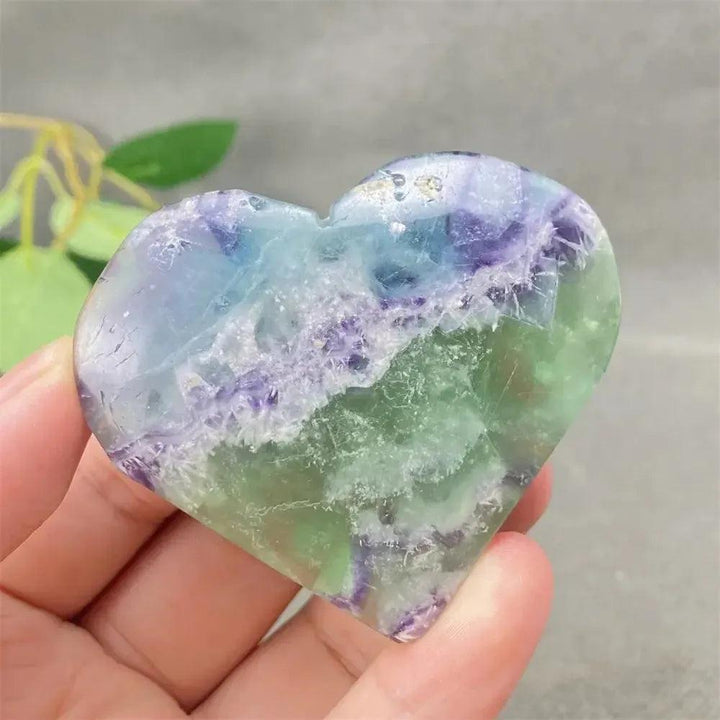 Feather Fluorite Crystal Heart: Polished heart-shaped crystal with calming purple, green, and blue bands for mental clarity.