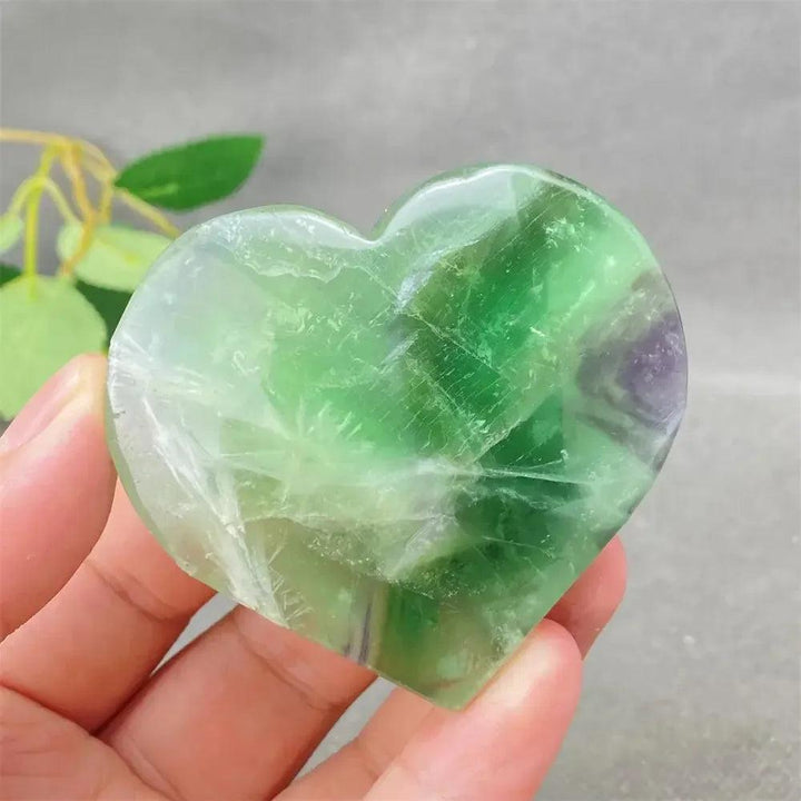 Polished Feather Fluorite Crystal Heart with vibrant green, purple, and clear bands, enhancing mental clarity and emotional balance.