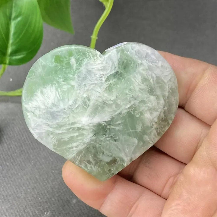 Polished Feather Fluorite Crystal Heart, showcasing calming green and white tones for mental clarity and emotional balance.