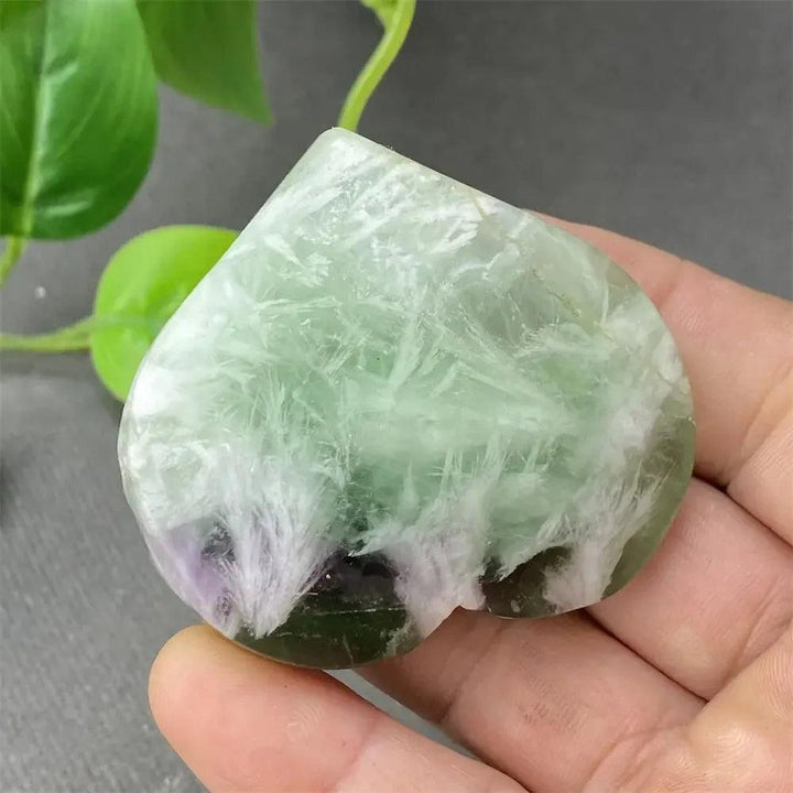 Feather Fluorite Crystal Heart: Polished green, purple, and white fluorite heart for mental clarity and focus.