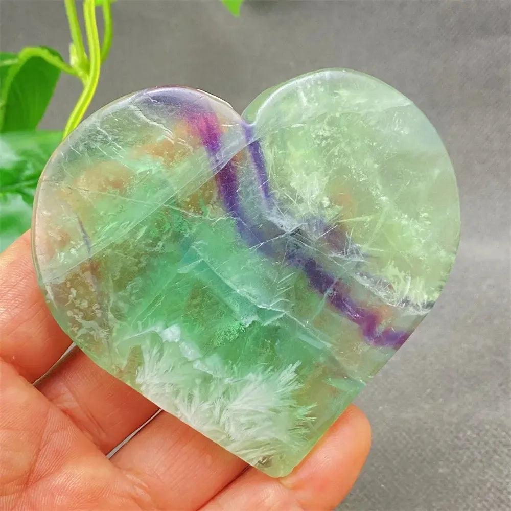 Feather Fluorite Crystal Heart: Polished green, purple, and clear fluorite heart for mental clarity and focus.