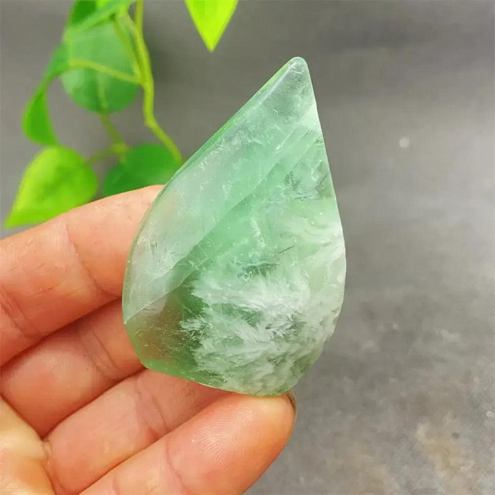 Polished green Feather Fluorite crystal heart, showcasing stunning bands and clarity for focus and emotional balance.