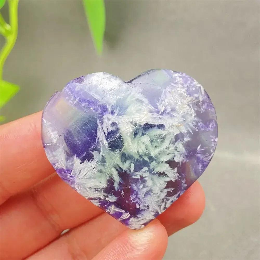 Feather Fluorite Crystal Heart: Polished purple, green, and white fluorite heart for mental clarity and emotional balance.