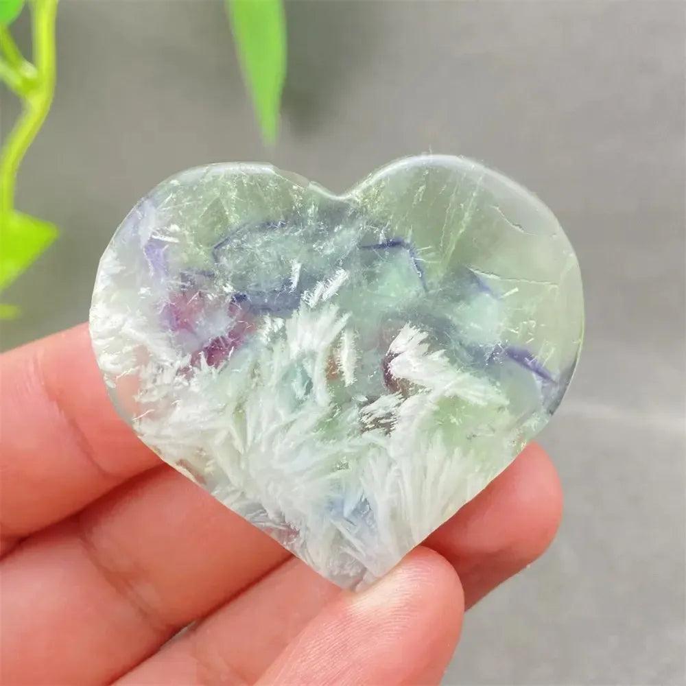 Feather Fluorite Crystal Heart: Polished heart-shaped Fluorite with calming purple, green, blue, and clear tones for clarity and focus.