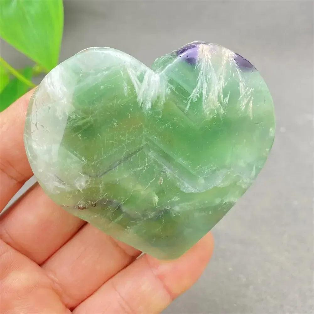 Polished Feather Fluorite Crystal Heart with vibrant green, purple, and clear bands, promoting mental clarity and focus.