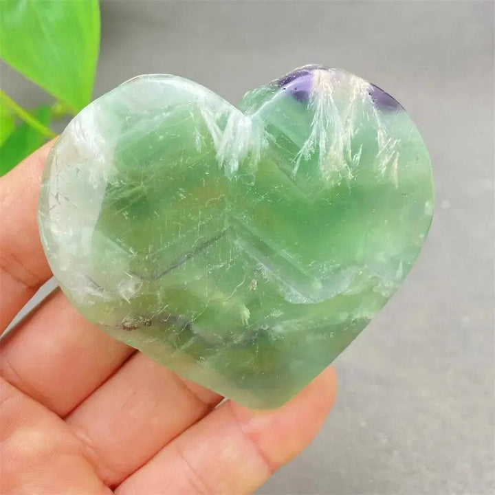 Polished Feather Fluorite Crystal Heart with vibrant green, purple, and clear bands, promoting mental clarity and focus.