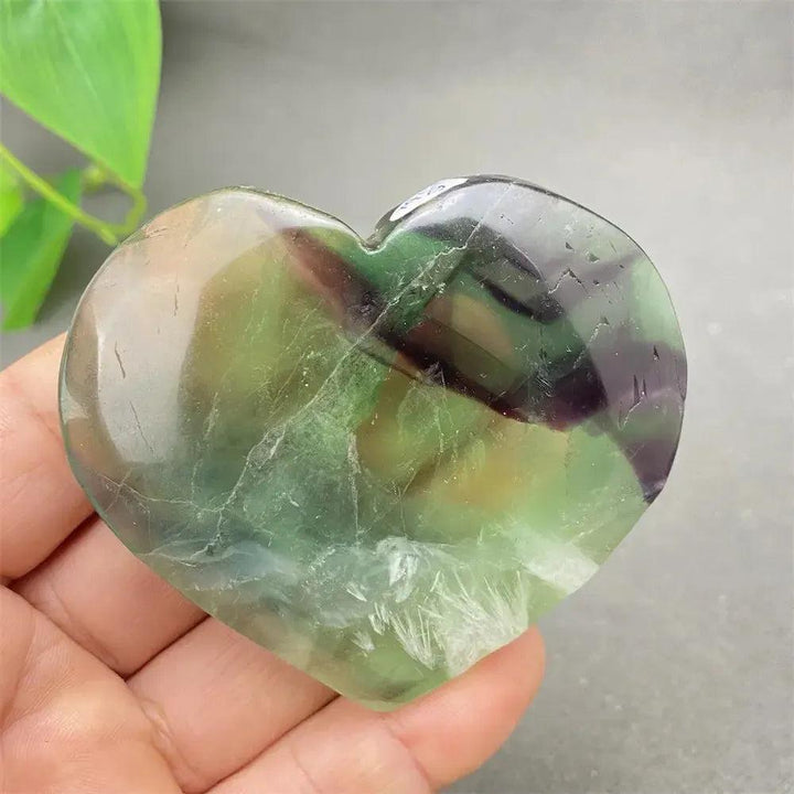 Feather Fluorite Crystal Heart: Polished purple, green, blue, and clear fluorite heart for mental clarity and focus.