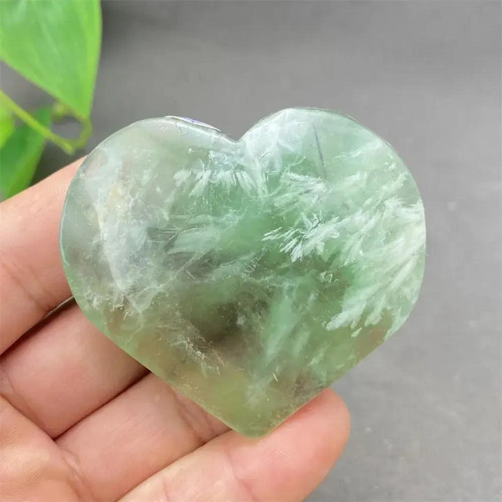 Polished Feather Fluorite Crystal Heart with calming green, white, and clear tones for mental clarity and emotional balance.