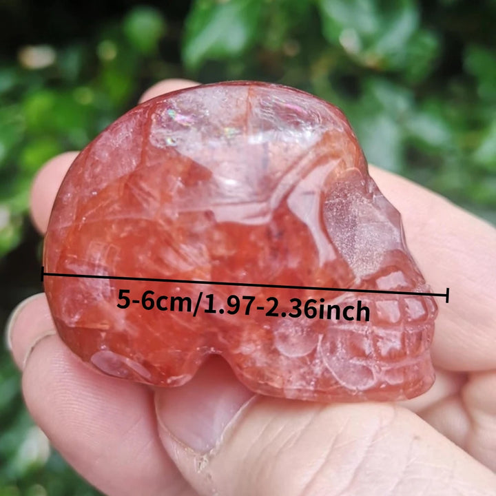Hand-carved 5-6cm natural Fire Quartz skull ornament, featuring vibrant red hues for healing and unique tabletop decor.