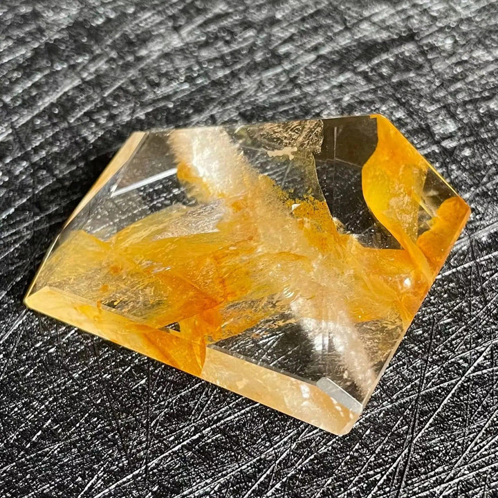 Polished Fire Quartz crystal freeform with warm orange and amber iron oxide inclusions, showcasing its unique glow.