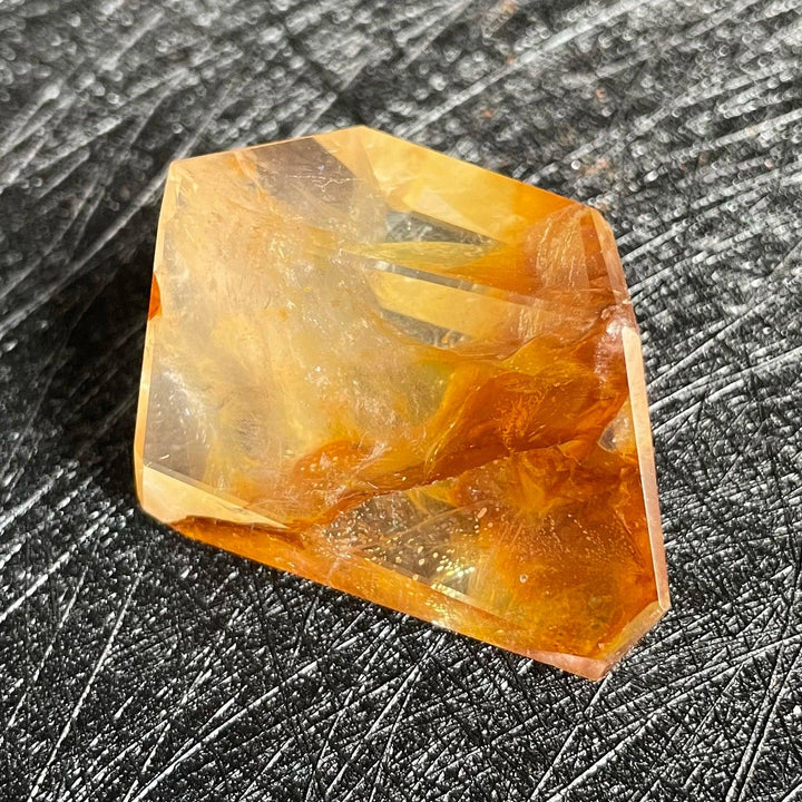 Polished Fire Quartz freeform with warm orange, rust, and amber iron oxide inclusions, glowing from within.