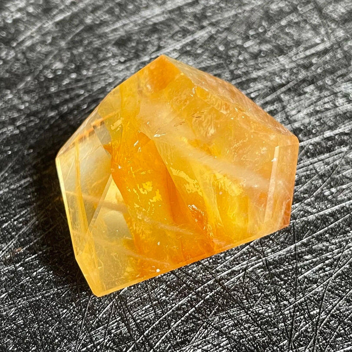 Polished Fire Quartz crystal freeform, showcasing warm orange and amber iron oxide inclusions within clear quartz.