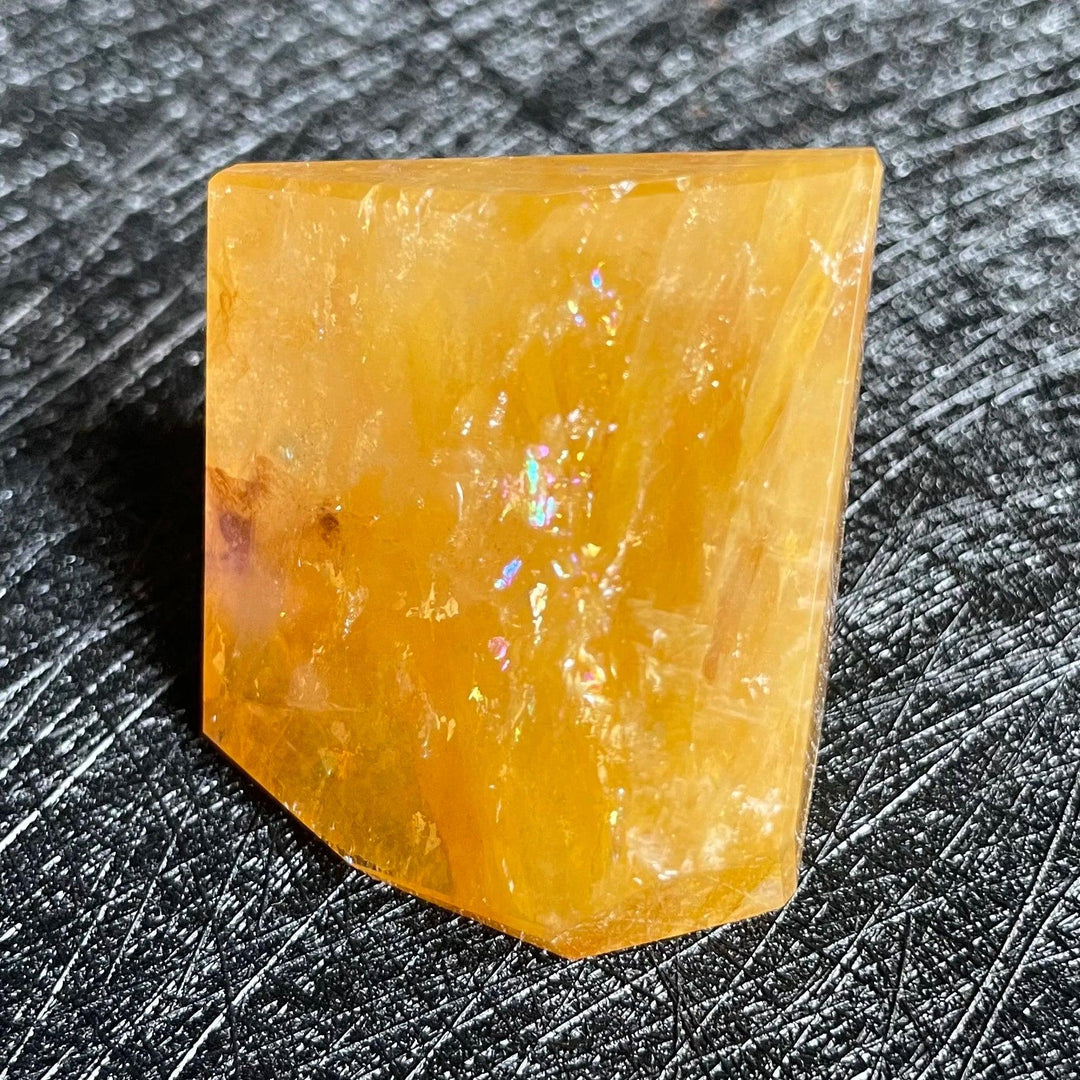 Polished Fire Quartz freeform crystal with warm orange and amber iron oxide inclusions, glowing from within.