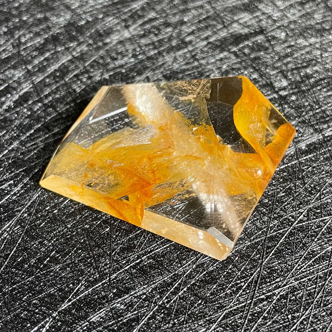 Polished Fire Quartz crystal freeform with warm orange and amber iron oxide inclusions, glowing within clear quartz.