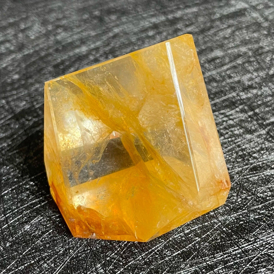 Polished Fire Quartz crystal freeform with warm amber and rust iron oxide inclusions, glowing from within.
