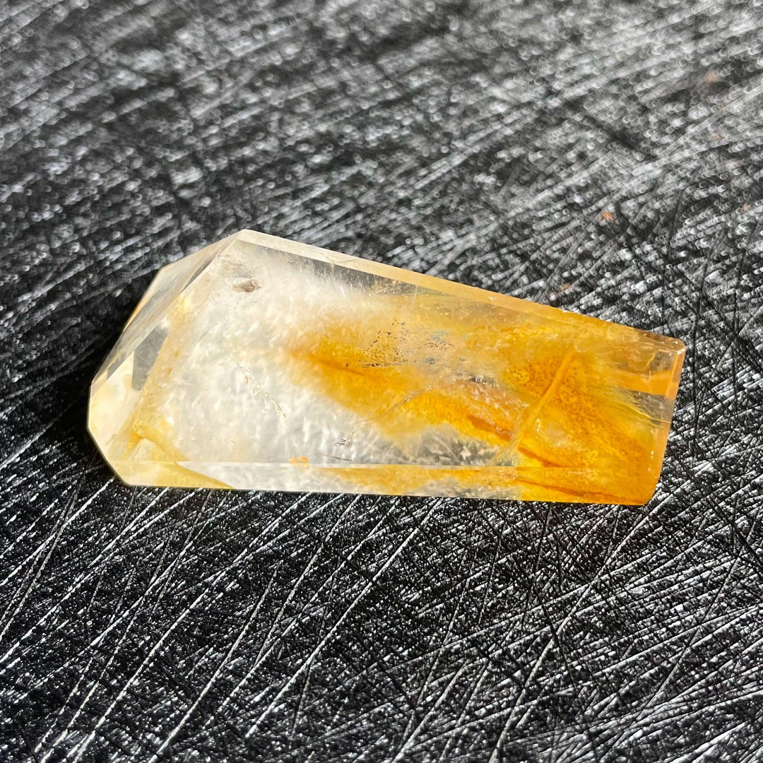 Polished Fire Quartz crystal freeform with warm amber and rust iron oxide inclusions, glowing from within.