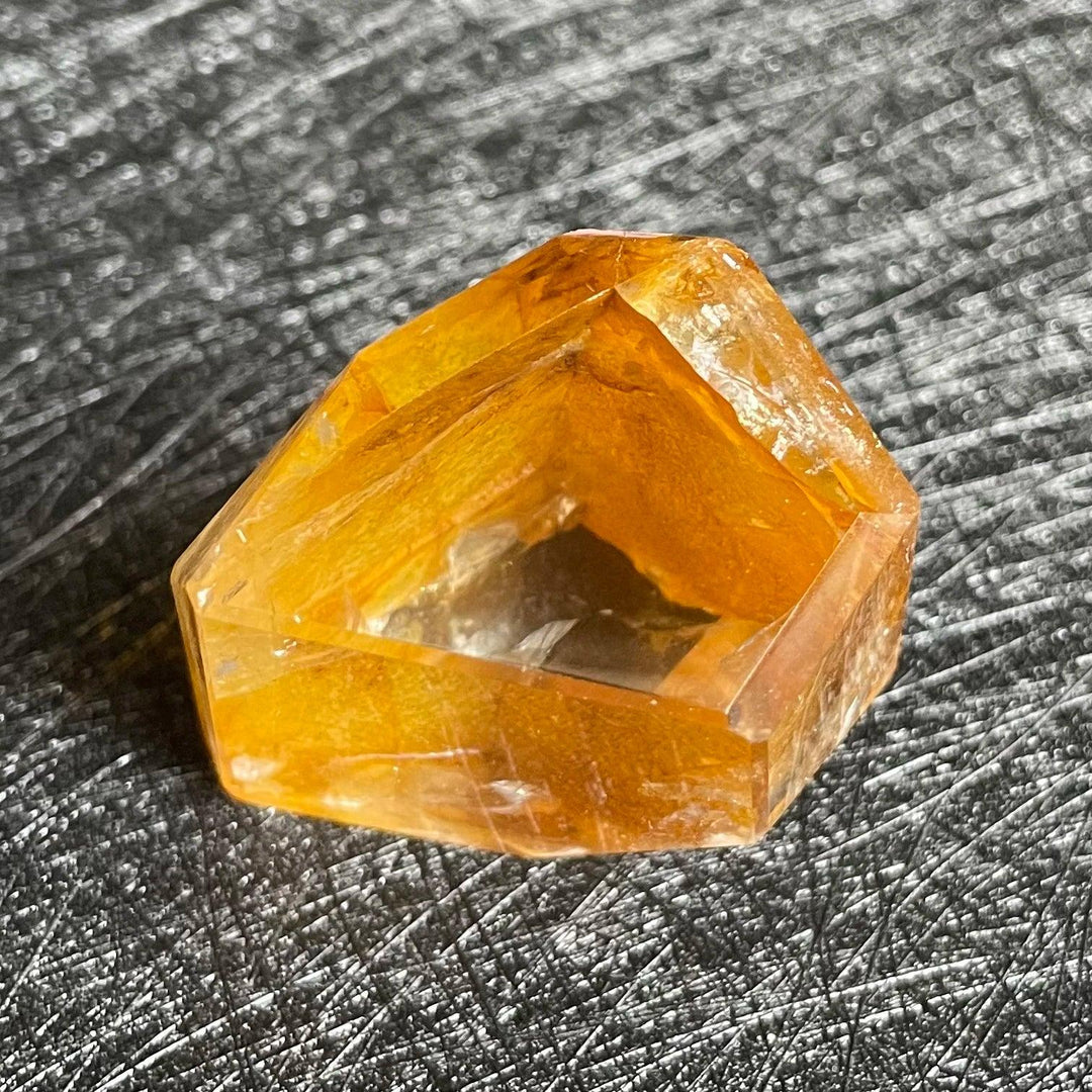 Polished Fire Quartz crystal freeform with warm amber and rust iron oxide inclusions, glowing from within.