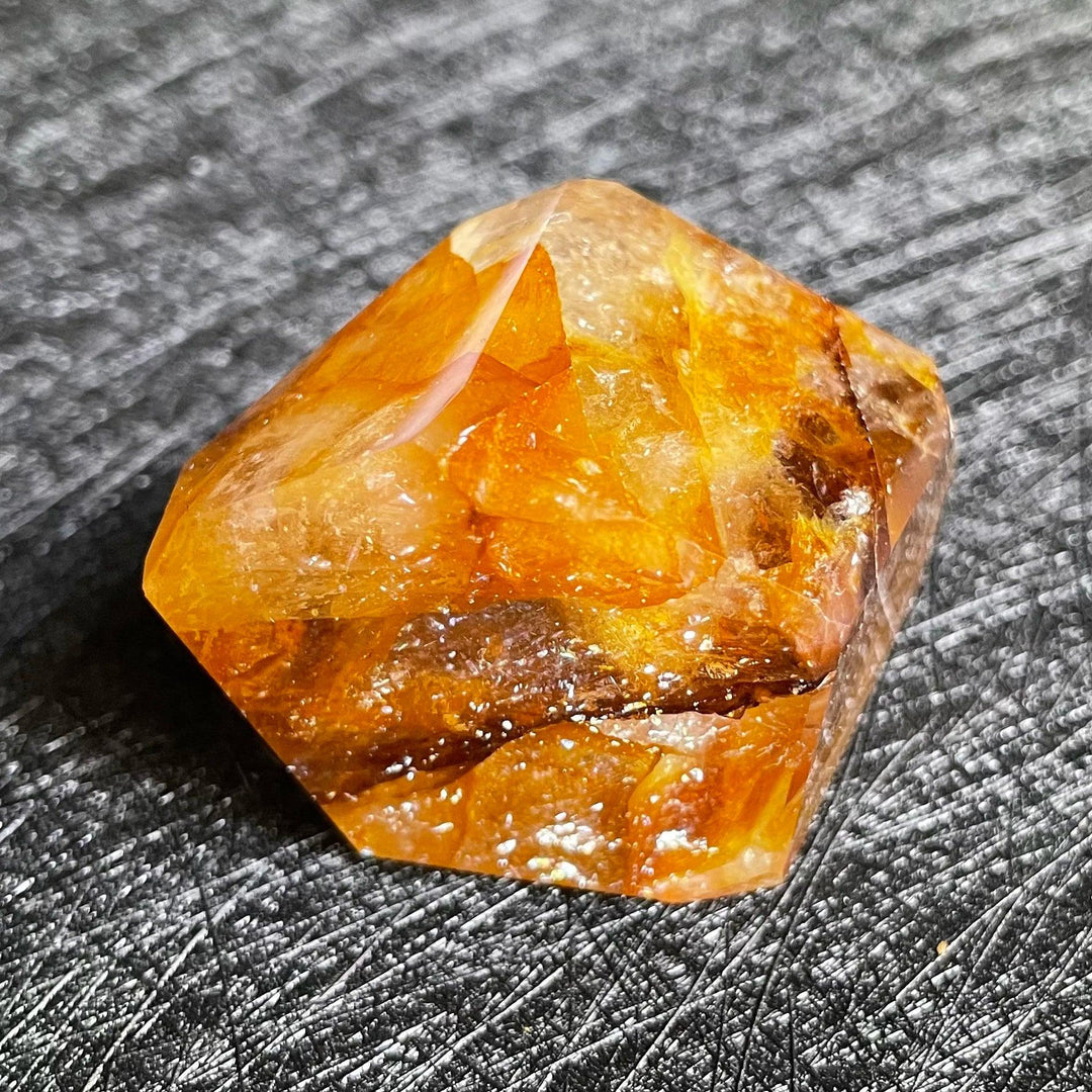 Polished Fire Quartz crystal freeform, showcasing warm amber and rust iron oxide inclusions within clear quartz.