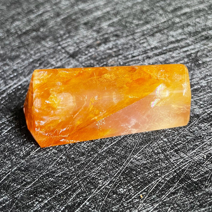 Polished Fire Quartz crystal freeform, glowing with warm orange, rust, and amber iron oxide inclusions.
