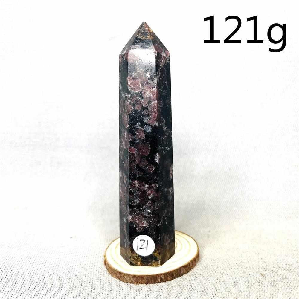 Fireworks Garnet tower featuring deep red crystals in a dark matrix, a polished stone for grounding energy and vitality.
