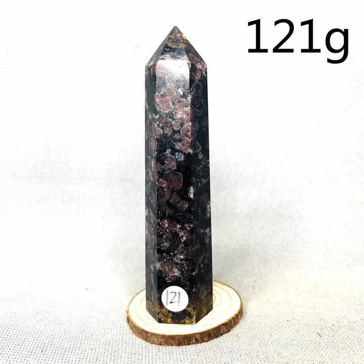 Fireworks Garnet tower featuring deep red crystals in a dark matrix, a polished stone for grounding energy and vitality.