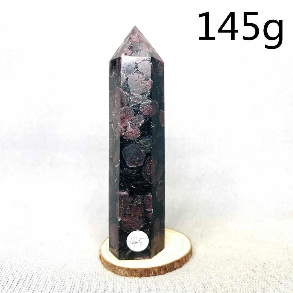 Fireworks Garnet Tower featuring deep red crystals in a dark matrix, a grounding stone for vitality and root chakra energy.