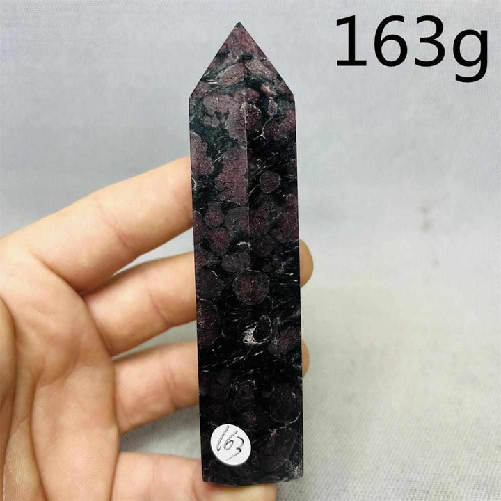 Fireworks Garnet tower featuring deep red crystals in a dark matrix, perfect for grounding energy and altar decor.
