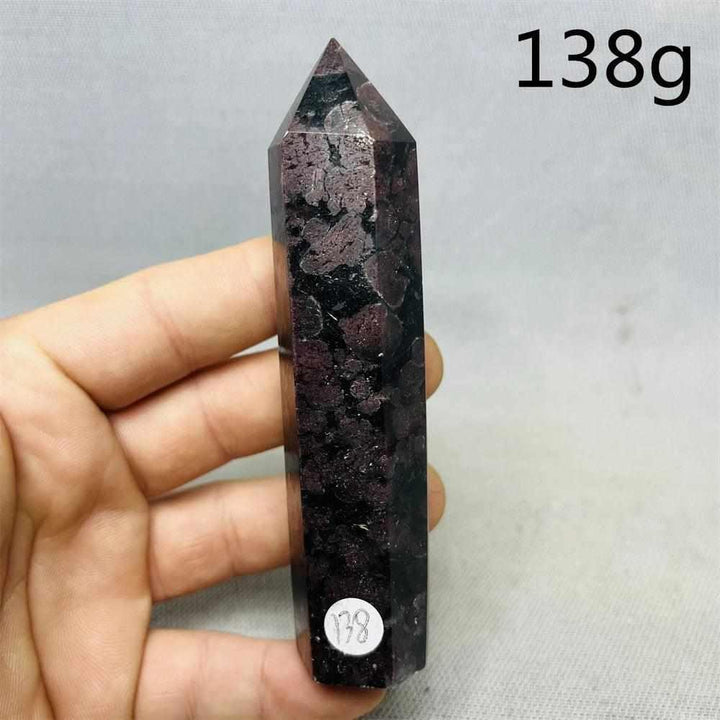 Polished Fireworks Garnet tower featuring deep red crystals in a dark matrix, perfect for grounding and root chakra energy.