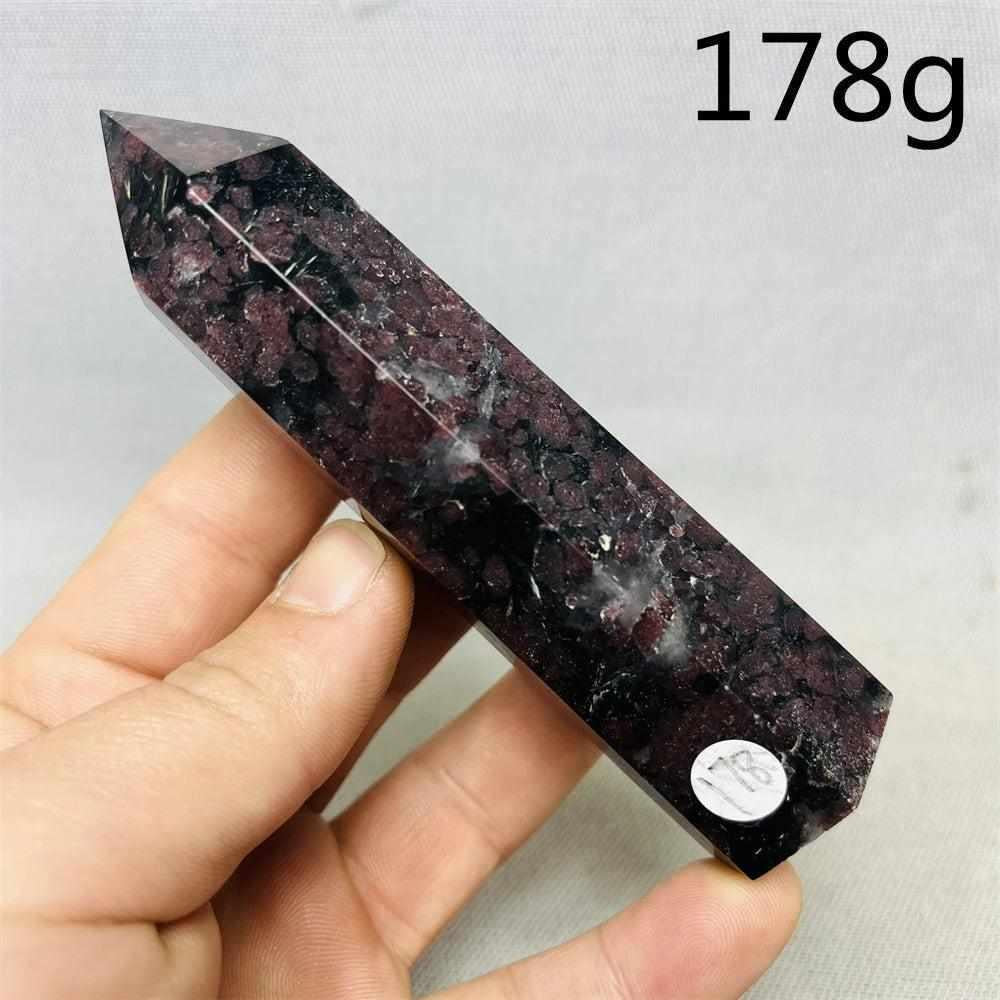 Polished Fireworks Garnet tower featuring deep red crystals in a dark matrix, perfect for grounding and vitality.