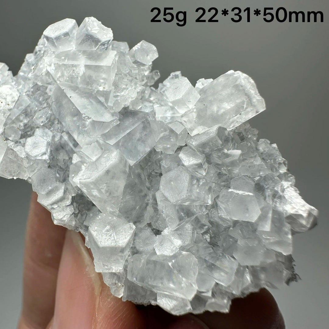 Highly transparent raw columnar calcite crystal cluster healing stone specimen.