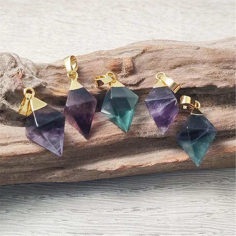Fluorite crystal rhombus drop pendants in violet and teal, set in gold-plated copper for focus and mental clarity.