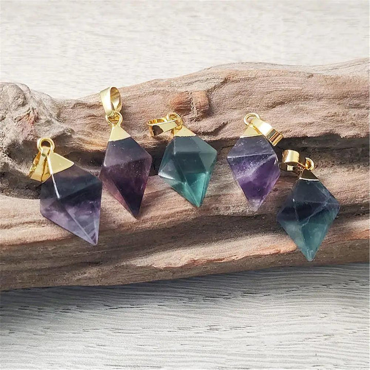 Fluorite crystal rhombus drop pendants in violet and teal, set in gold-plated copper for focus and mental clarity.