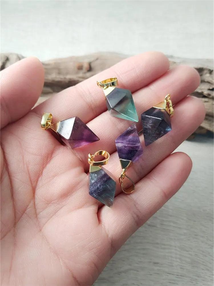 Fluorite crystal rhombus drop pendants in violet and teal, set in gold-plated copper for focus and mental clarity.