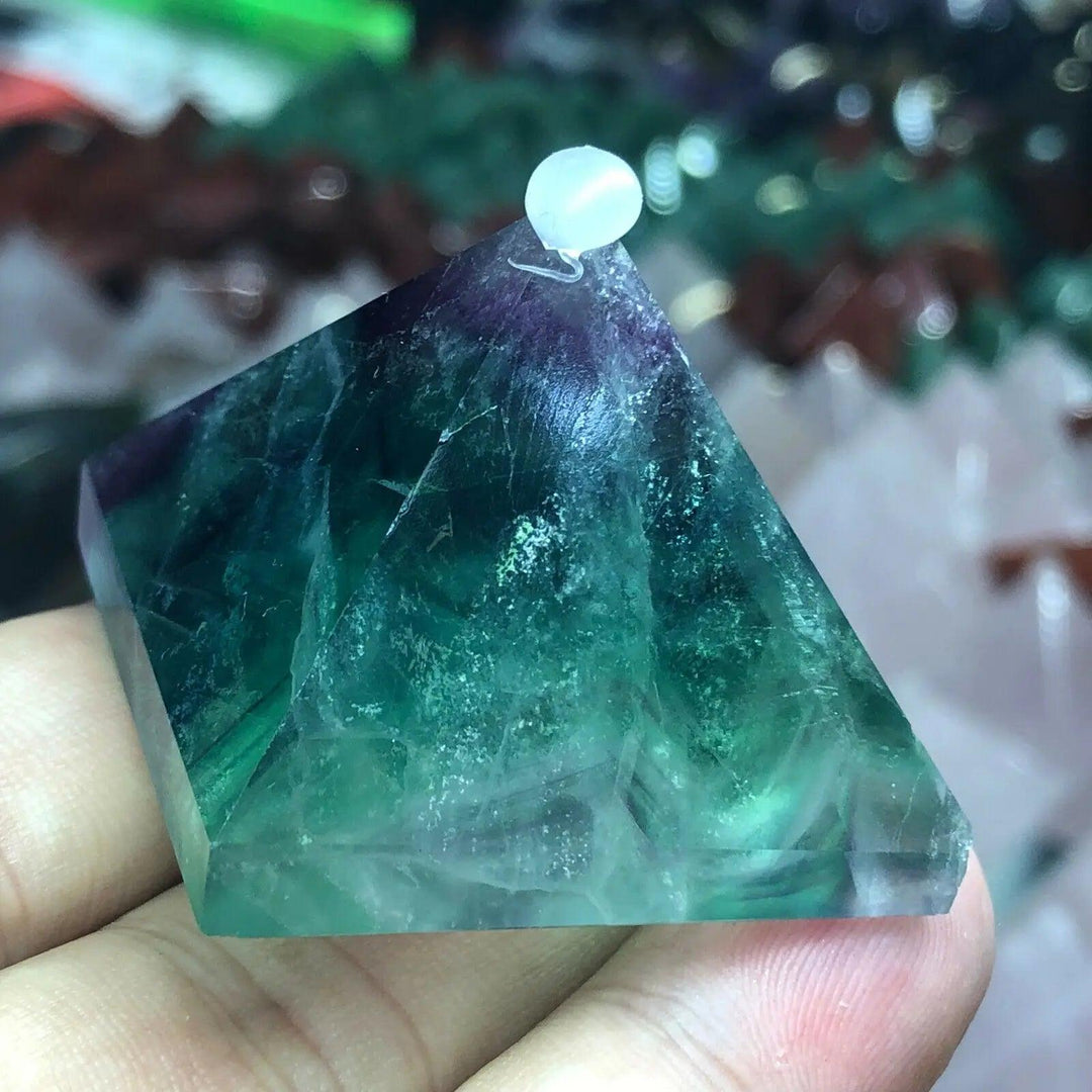 Vibrant Fluorite Crystal Pyramid for Focus and Calm, showcasing shifting purple, green, and teal hues.