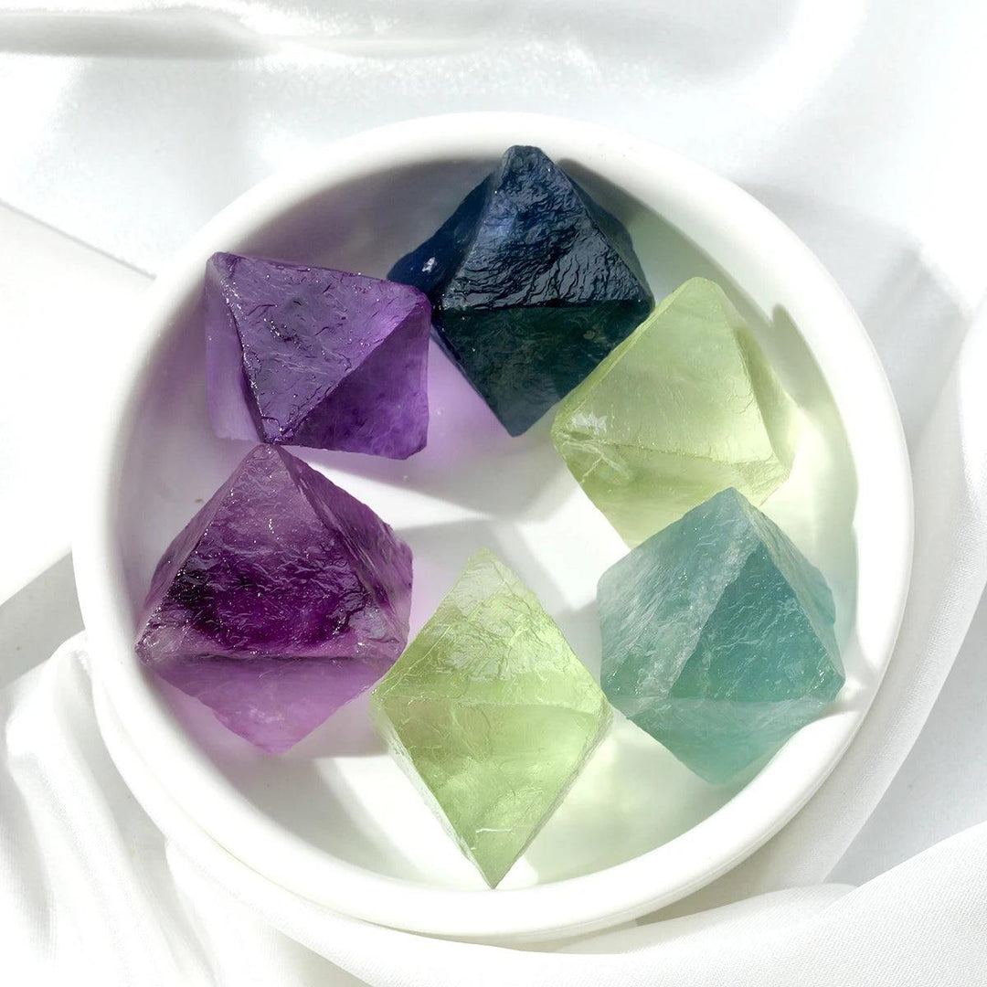 Raw Fluorite Crystal Octahedrons in deep violet, seafoam green, and cool blue for focus, healing, and purification.