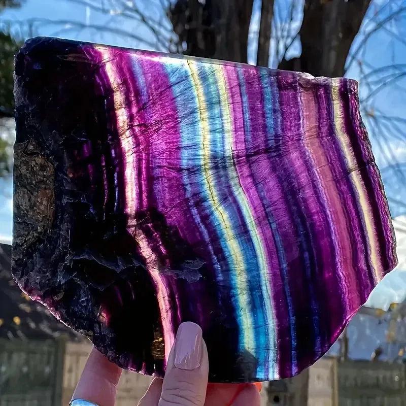 Fluorite Crystal Slice: Natural rainbow stone with vibrant purple, green, and blue bands for mental clarity.
