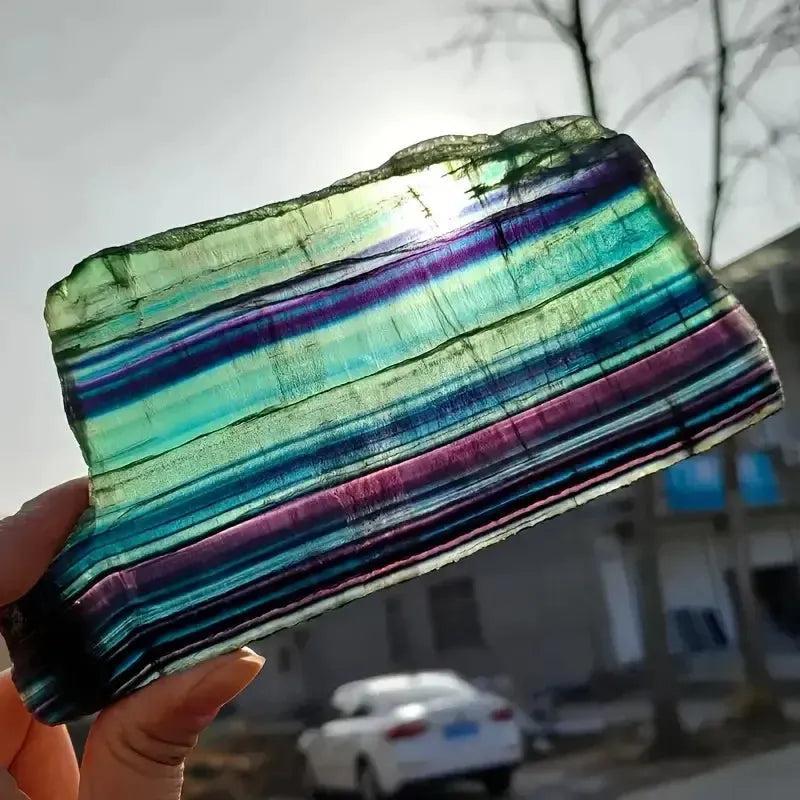 Rainbow Fluorite Crystal Slice from Crystal Destiny, showcasing vibrant purple, green, and teal bands for clarity and focus.