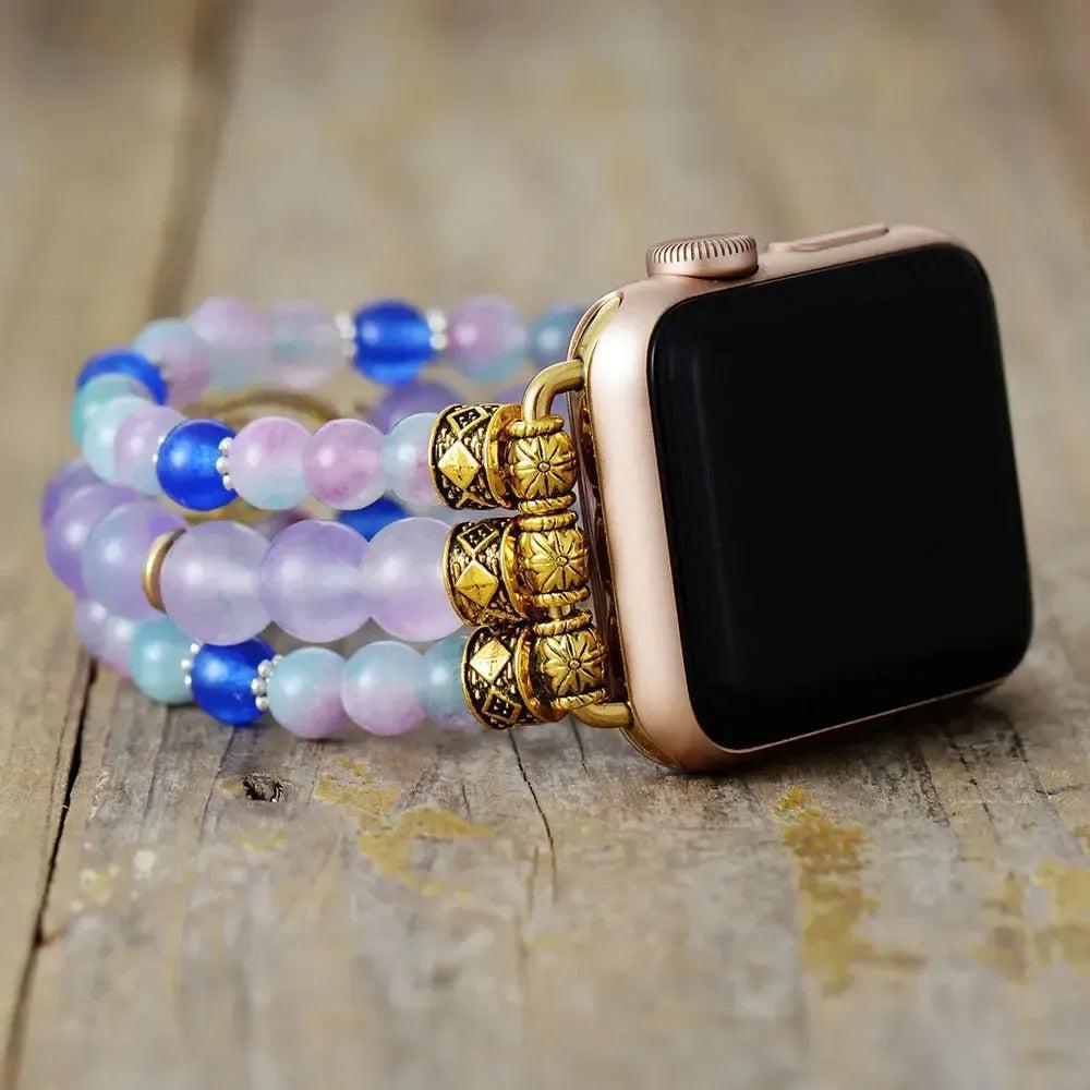Fluorite Evil Eye Apple iWatch Band with multicolored purple, green, blue beads, zircon evil eye, and gold connectors.