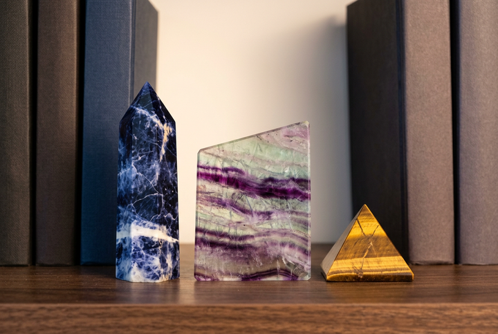 Focus & Concentration crystal set: Sodalite, Rainbow Fluorite and Tiger's Eye on a bookshelf