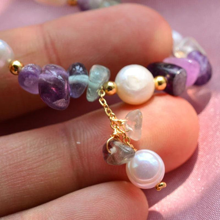 Natural Freshwater Pearl & Purple Crystal 14K Gold Filled Female Charm Bracelet with baroque pearls and star-shaped crystals.