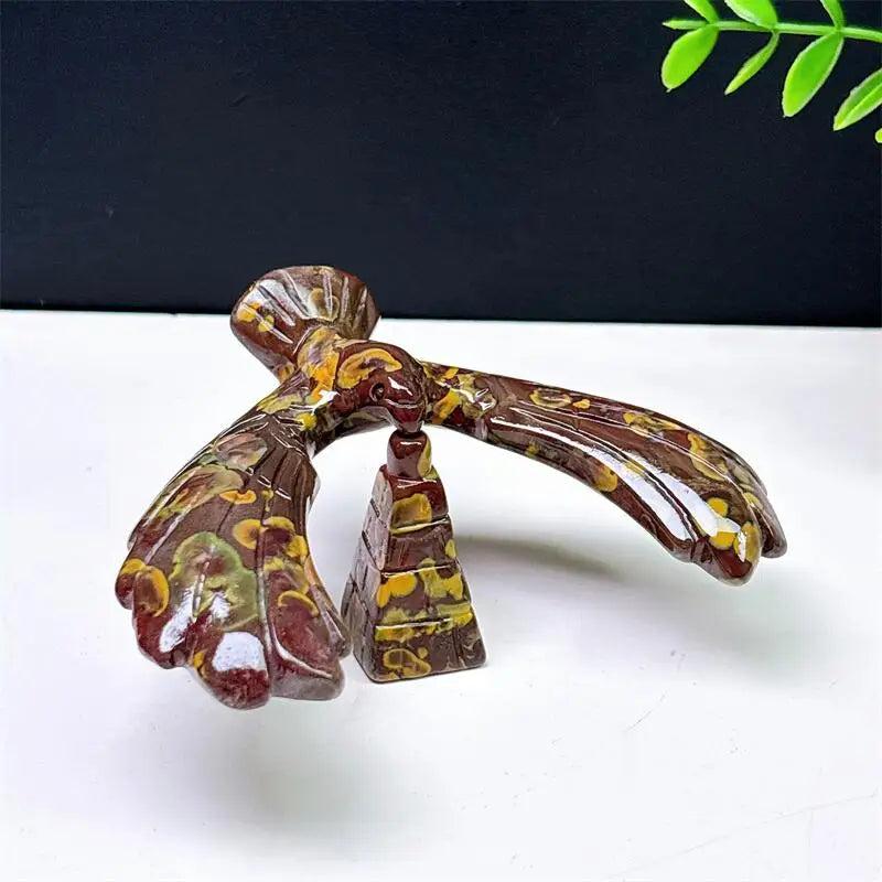 Fruit Jasper crystal eagle and pyramid spinning statue with unique brown and yellow patterns for grounding and stability.
