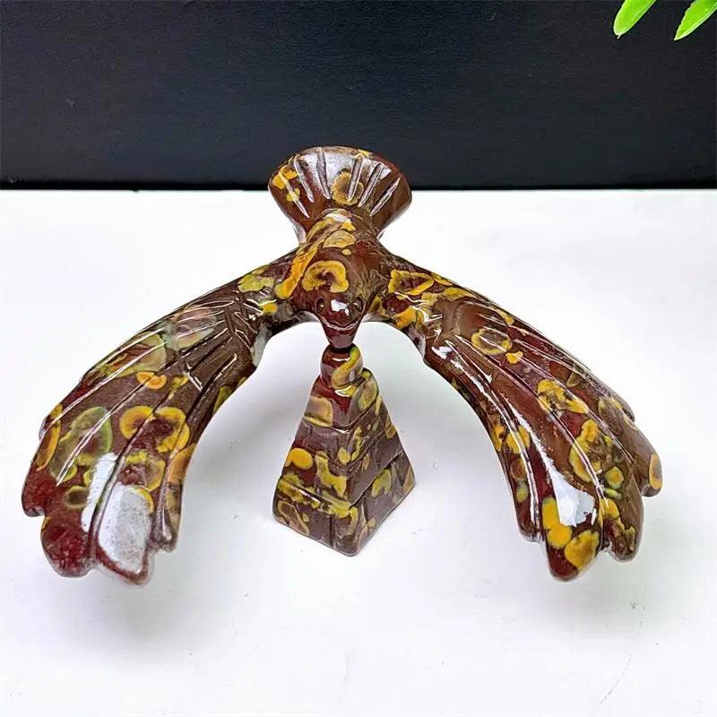 Fruit Jasper crystal eagle and pyramid spinning statue with unique brown and yellow patterns for grounding and stability.
