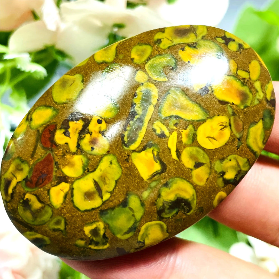 Polished Fruit Jasper Crystal Palm Stone with vibrant green and yellow patterns for grounding and healing.