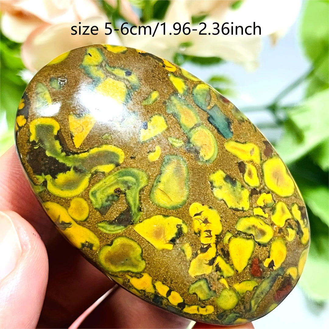 Polished Fruit Jasper Crystal Palm Stone with vibrant green and yellow patterns for grounding and healing.