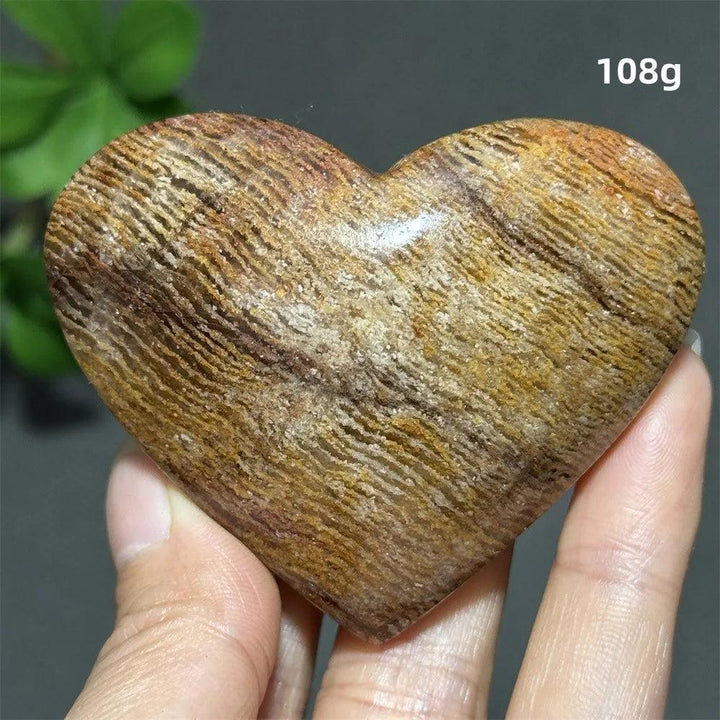 108g Natural Garden Thousand-Layer crystal heart for Feng Shui, featuring earthy banded textures for healing and meditation.