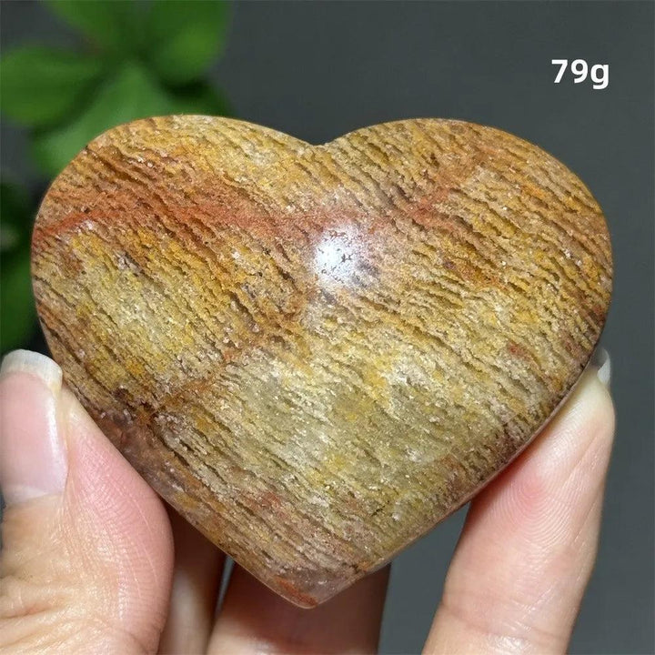 79g Natural Garden Thousand-Layer crystal heart ornament with golden layered patterns for healing and Feng Shui decor.