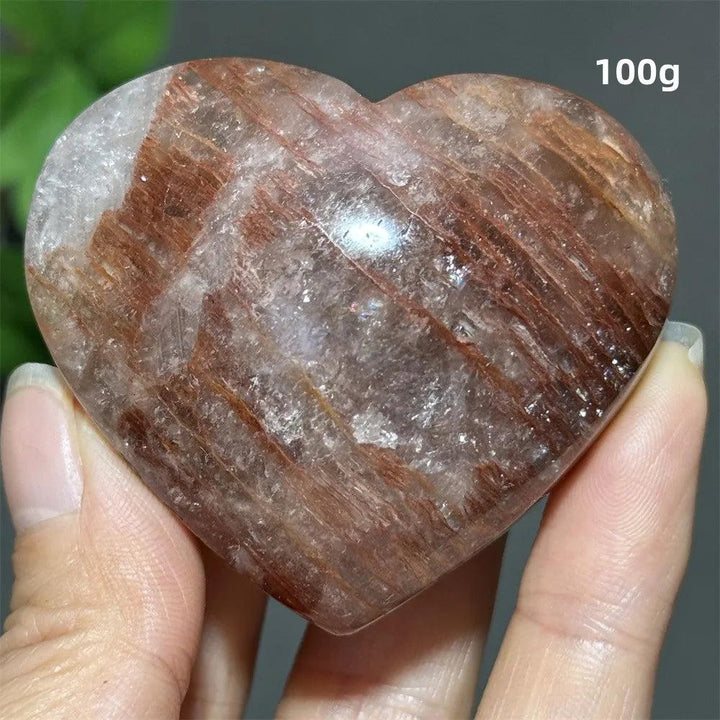 100g heart-shaped natural garden quartz crystal ornament with red inclusions for healing, meditation, and feng shui decor.