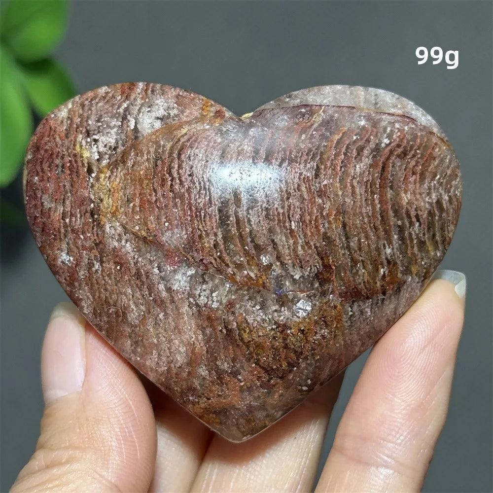 99g heart-shaped Natural Garden Thousand-Layer crystal ornament with layered red textures for spiritual healing and luck.